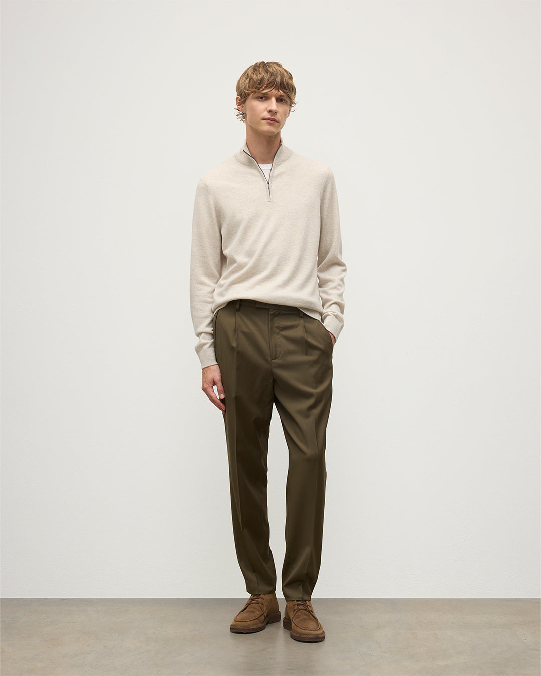 MODEL WEARING JOHNSTONS OF ELGIN MENS RORY CLASSIC HALF ZIP CLASSIC SWEATER 100% CASHMERE WITH OLIVE GREEN TROUSERS KAP05695HA0402