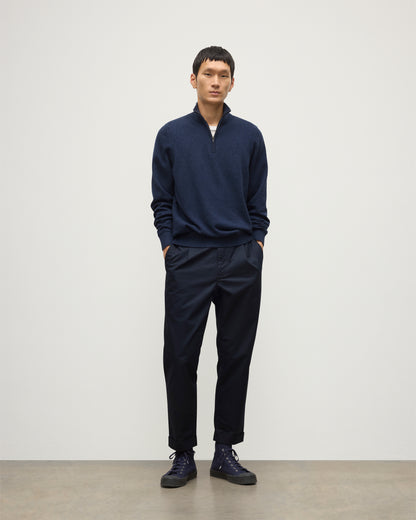 MODEL WEARS JOHNSTONS OF ELGIN MENS RORY CLASSIC HALF ZIP CLASSIC SWEATER 100% CASHMERE  OVER A WHITE T-SHURT WITH NAVY TROUSERS KAP05695HD7350