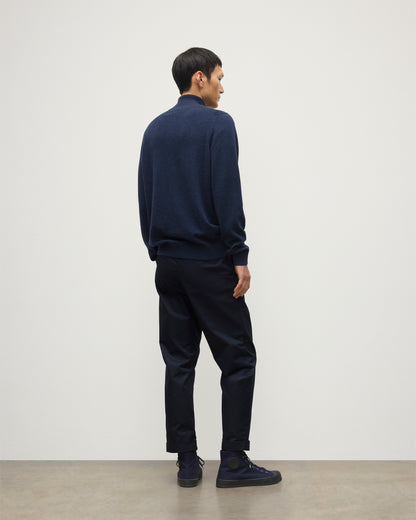 MODEL WEARS JOHNSTONS OF ELGIN MENS RORY CLASSIC HALF ZIP CLASSIC SWEATER 100% CASHMERE  OVER A WHITE T-SHURT WITH NAVY TROUSERS KAP05695HD7350