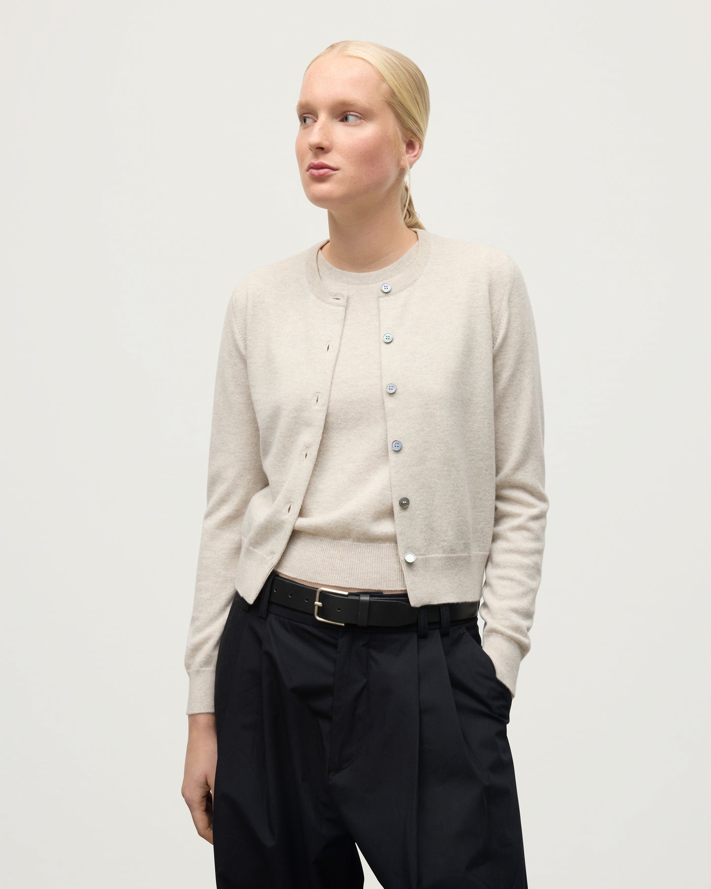 MODEL WEARING JOHNSTONS OF ELGIN WOMENS IRIS CLASSIC CREW CARDIGAN NATURAL 100% CASHMERE KAP05704HA0402