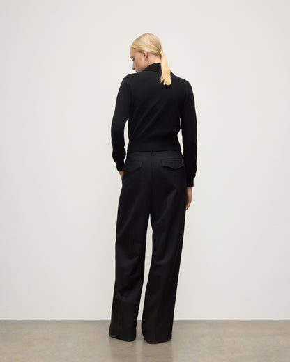 MODEL WEARS JOHNSTONS OF ELGIN WOMENS CRATHIE SHAWL CARDIGAN BLACK 100% CASHMERE WITH BLACK TROUSERS KAP05707SA7210