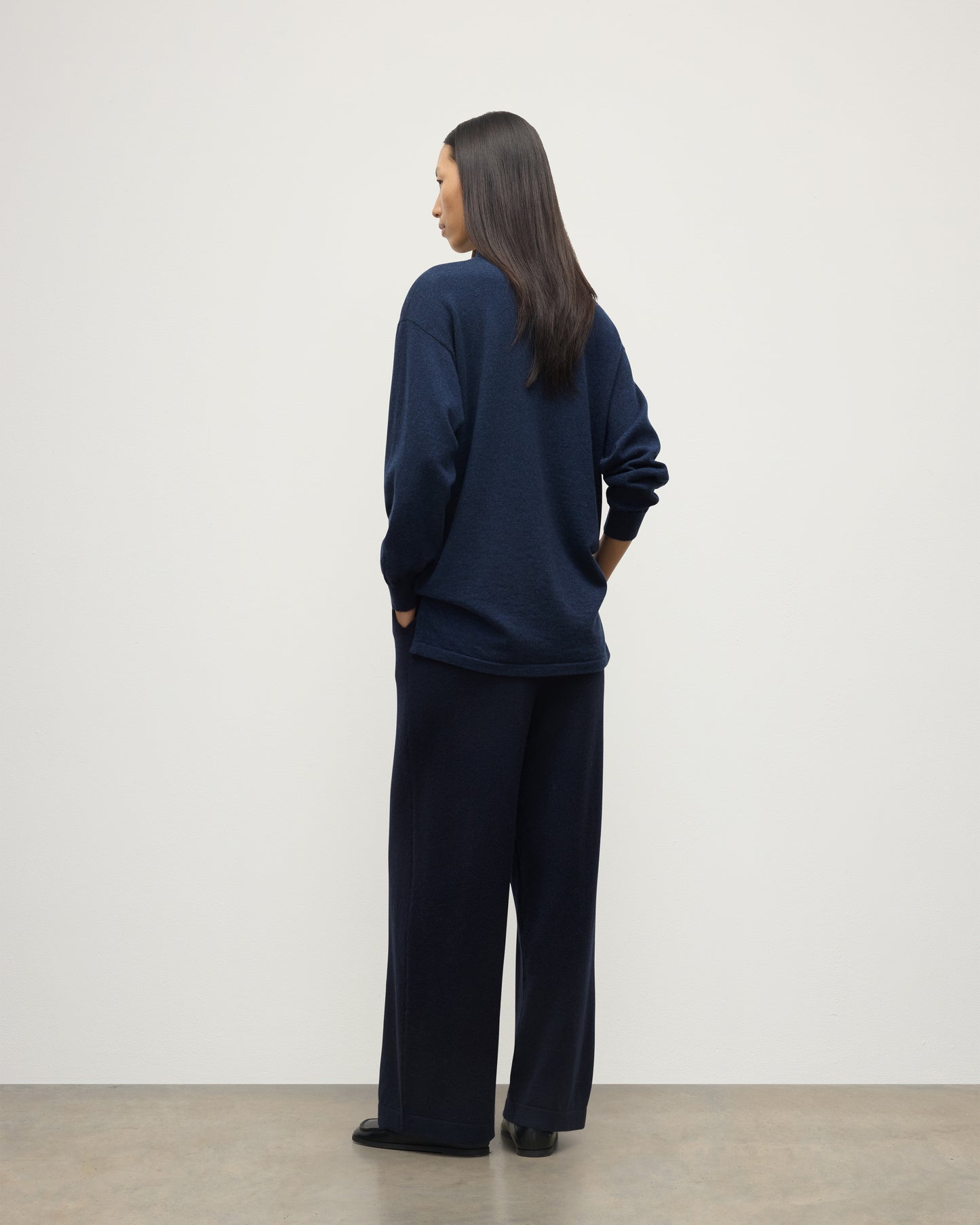 MODEL WEARS JOHNSTONS OF ELGIN WOMENS MUNRO SHIRT NAVY 100% CASHMERE WITH CASHMERE CULOTTES KAP05765HD7350