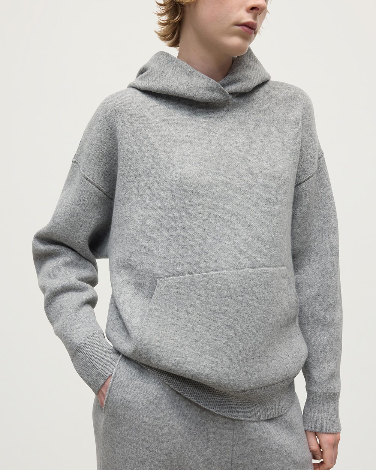 Model wears  Johnstons of Elgin AW25 Women's Knitwear Light Grey & White Double-Face Grey Cashmere Hoodie Close up KBA01034Q25324