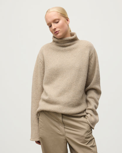 FEMALE MODEL WEARING JOHNSTOS OF ELGIN KESTER FUNNEL NECK SWEATER NATURAL 100% CASHMERE UAC05753006876