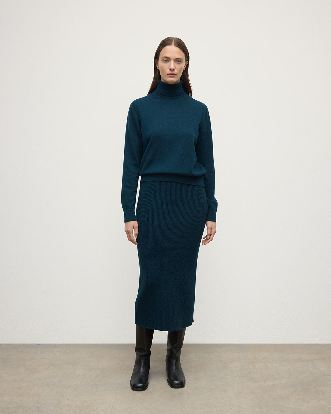 model wears Johnstons of Elgin AW25 Women's Knitwear Bottle Green Cashmere Green Midi Skirt Front View KBC01032SC7341