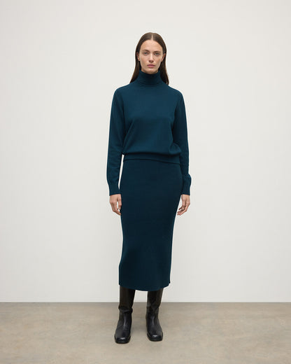 model wears Johnstons of Elgin AW25 Women's Knitwear Bottle Green Cashmere Green Midi Skirt Front View KBC01032SC7341
