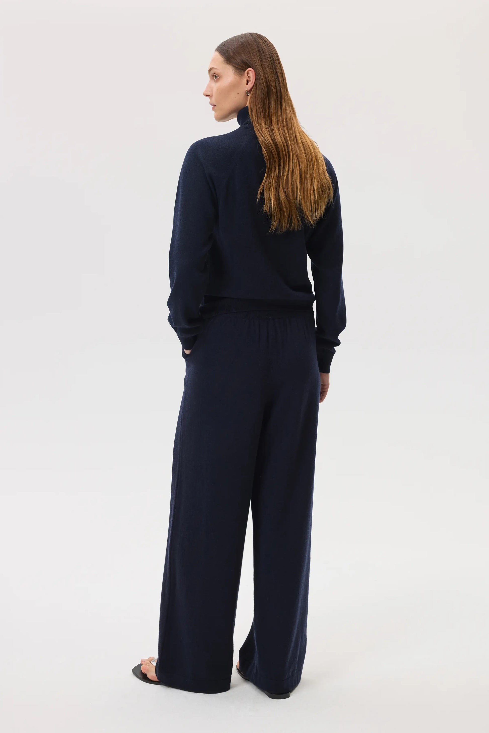Johnstons of Elgin SS25 Women's Knitwear Navy High Rise Cashmere Culottes worn with navy cashmere roll neck sweater KBP00926SD7286