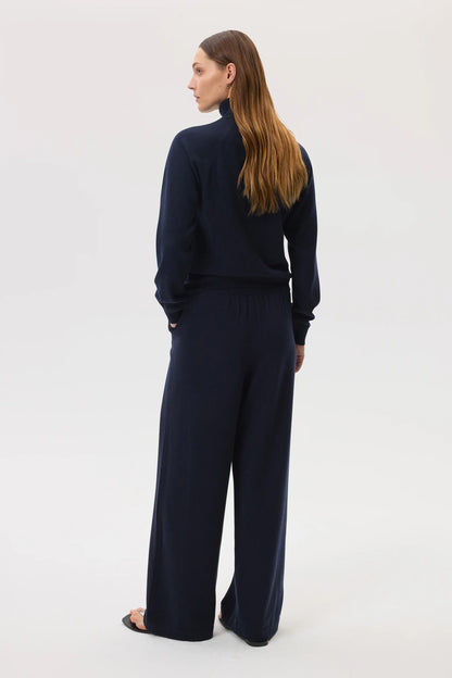 Johnstons of Elgin SS25 Women's Knitwear Navy High Rise Cashmere Culottes worn with navy cashmere roll neck sweater KBP00926SD7286