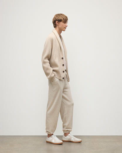 MODEL WEARING JOHNSTONS OF ELGIN MENS KIRK SWEATPANTS NATURAL 97% CASHMERE 3% POLYESTER WITH A WHITE T-SHIRT AND PIONEER CASHMERE CARDIGNA IN NATURAL KBP00948HA0402