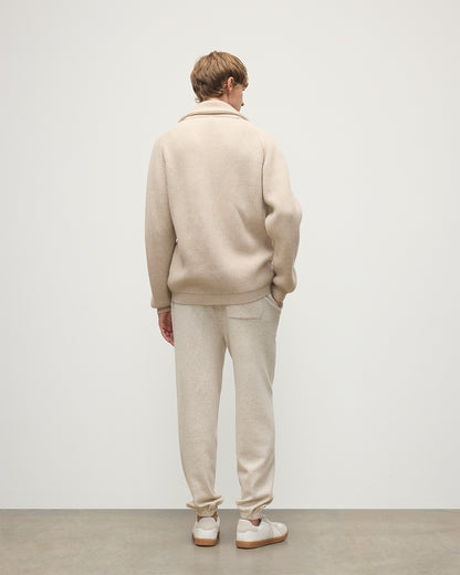 MODEL WEARING JOHNSTONS OF ELGIN MENS KIRK SWEATPANTS NATURAL 97% CASHMERE 3% POLYESTER WITH A WHITE T-SHIRT AND PIONEER CASHMERE CARDIGNA IN NATURAL KBP00948HA0402