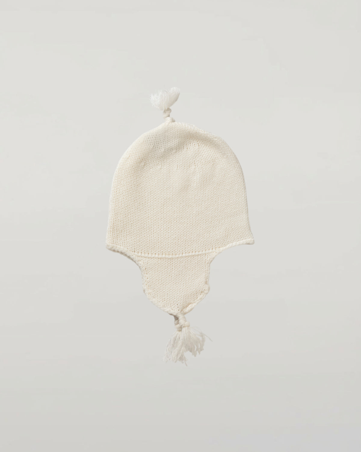 Johnstons of Elgin’s Gift Set includes our Cashmere Pointelle Baby Blanket, Hat, Mittens & Booties in Ecru on a white background AW21GIFTSET18A