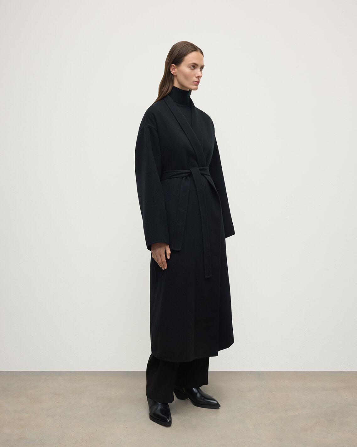 Model wears Johnstons of Elgin Women's Tailoring Black Black Cashmere Wrap Coat Front View TA000621RU6432