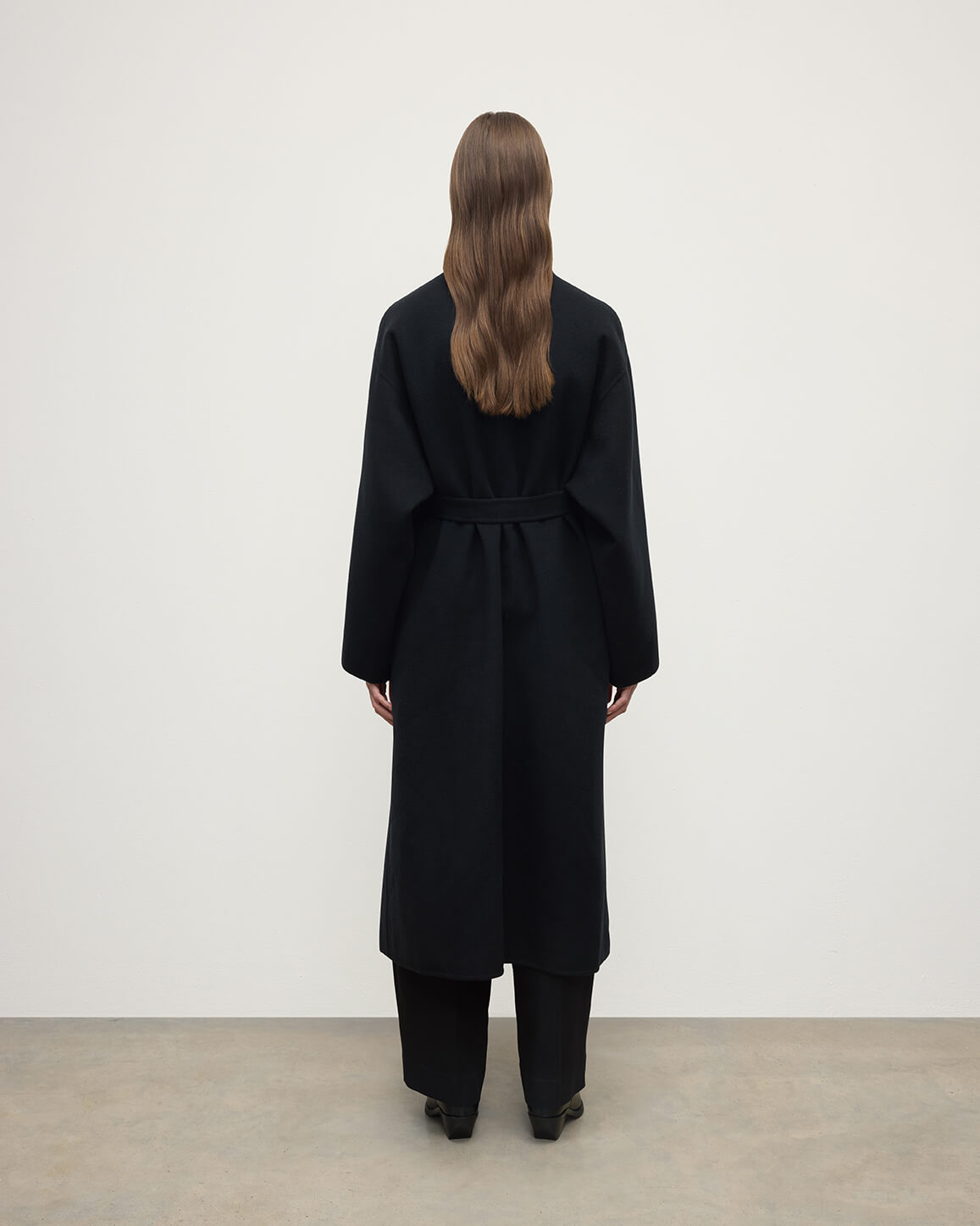 Model wears Johnstons of Elgin Women's Tailoring Black Black Cashmere Wrap Coat Front View TA000621RU6432