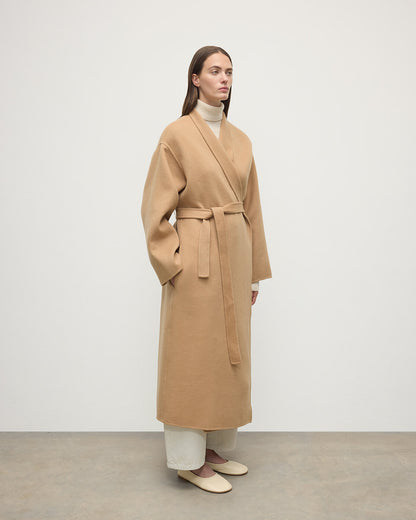 Model wears Johnstons of Elgin Women's Tailoring Camel Camel Cashmere Wrap Coat Front View  TA000621RU7397