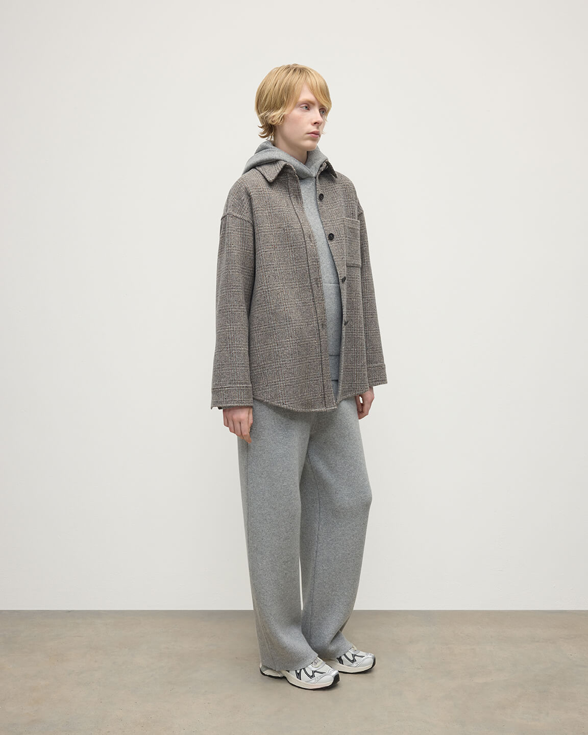 Model wearing Johnstons of Elgin  Women's Tailoring Ash Small Glen Urquhart Glen Urquhart Check Oversized Shirt Side View TB000754RU7675
