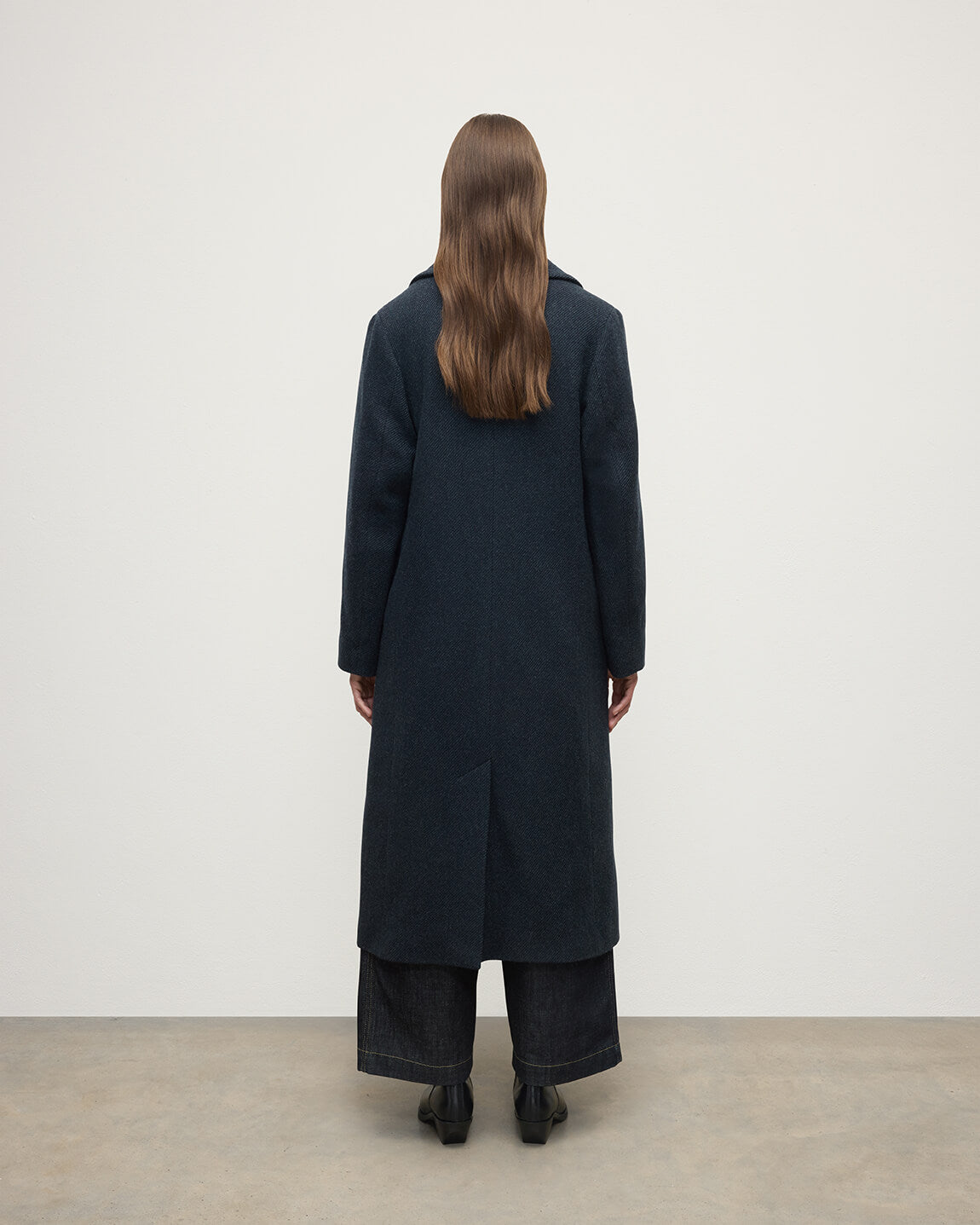 Model wearing Johnstons of Elgin  Women's Tailoring Bottle Dark Twill The Great Coat in Green Front View TD000438RU7672
