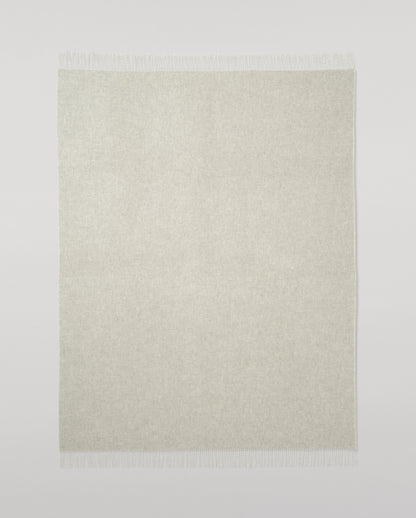 Johnstons of Elgin Light Grey & White reversible blanket on a grey background WA000013RU5059ONE