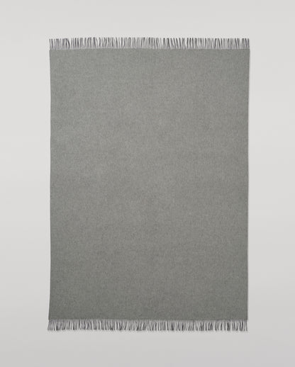 Johnstons of Elgin Interiors Collection  Reversible Navy & Light Grey Cashmere Throw on a wooden chair  WA000013RU6632N/A