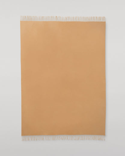 Johnstons of Elgin Interiors Collection Camel Camel Cashmere Throw on a wooden chair WA000055HB4315ONE