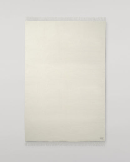 Johnstons of Elgin Interiors Collection White Cashmere Throw on grey background WA000055SA0000ONE