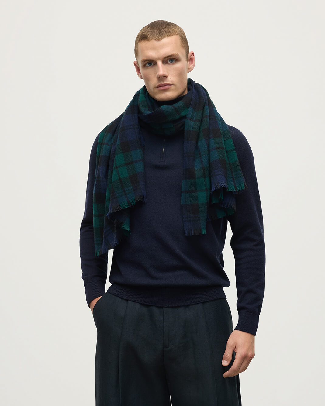 Model wearing Johnstons of Elgin AW25 Woven Accessories Black Watch Lightweight Cashmere Black Watch Tartan Stole WA001174KU0317N/A