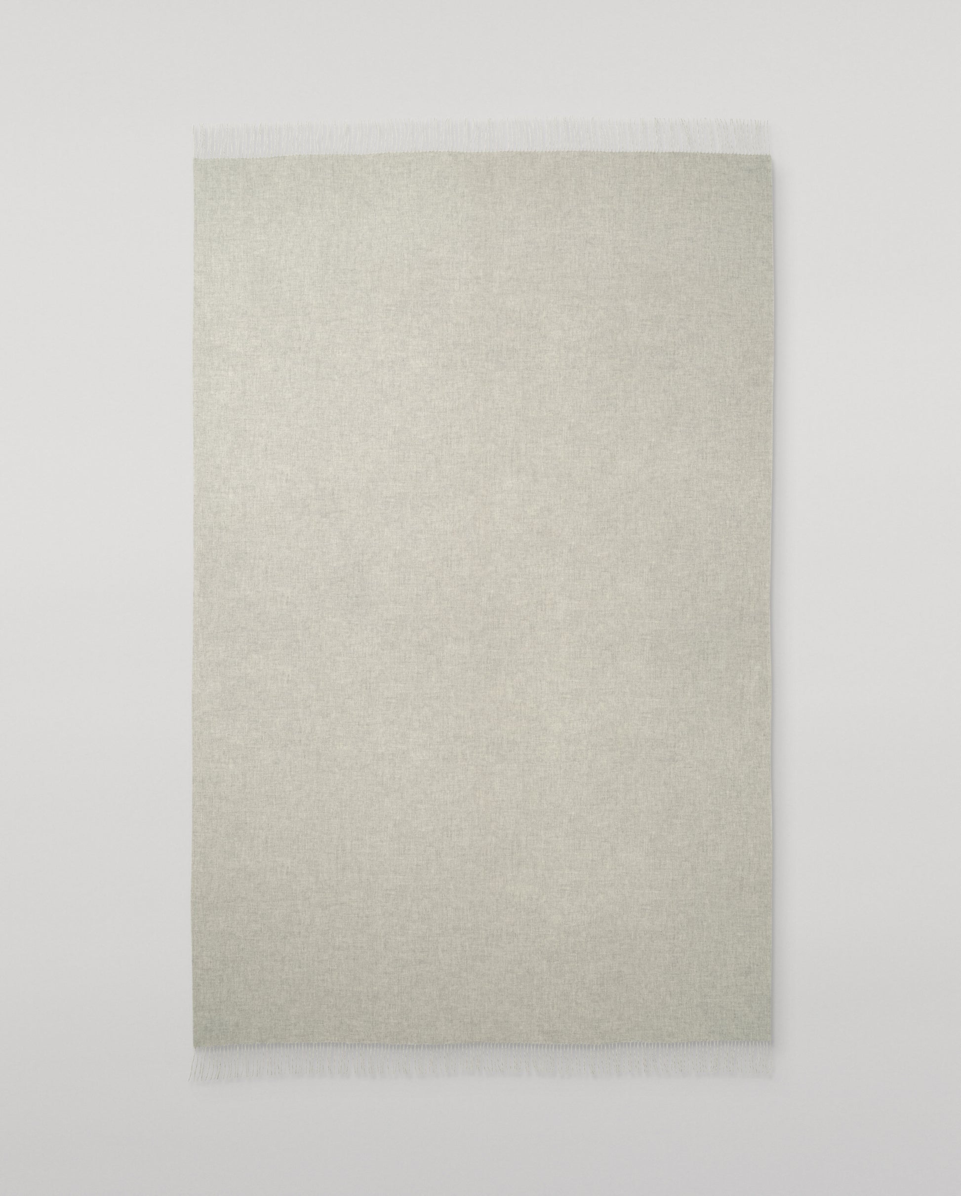 Johnstons of Elgin Interiors Collection Silver & White Reversible Cashmere Bed Throw on a white background  WA001374RU6322ONE