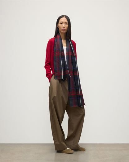 MODEL WEARS JOHNSTONS OF ELGIN ORTON CRAMMED TARTAN SCARF NAVY 100% CASHMERE WOEN OVER CRATHIE RED CASHMERE SHAWL COLLAR CARDI WA002447RU7703ONE