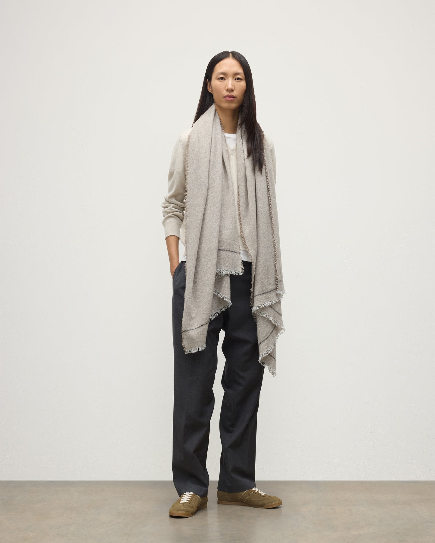 FEMALE MODEL WEARS JOHNSTONS OF ELGIN USAN SEMI PLAIN SCARF NATURAL 100% CASHMERE OVER A NATURAL CASHMERE SWEATER WA002550RU7719ONE