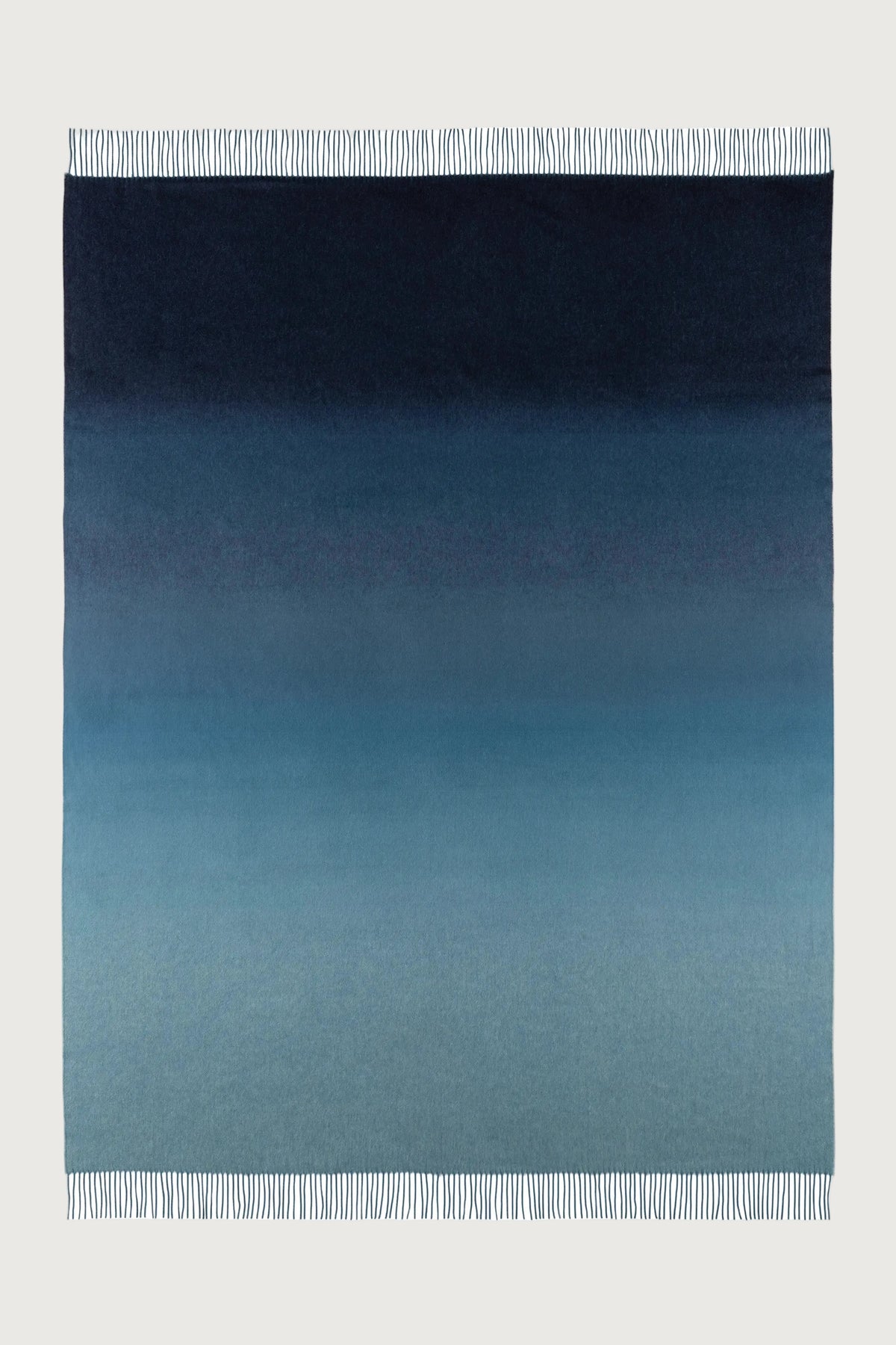 2025 Johnstons of Elgin Interiors Collection Seascape & Navy Ombré Cashmere Throw on a white background  WA000055RU7686ONE