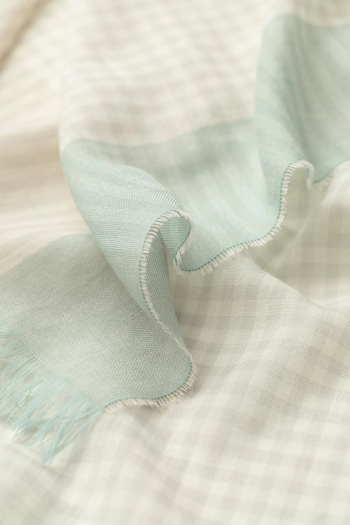 Johnstons of Elgin SS25 Accessories Gingham Border Lightweight Scarf close up detail of fabric and pattern WD001093RU7599ONE