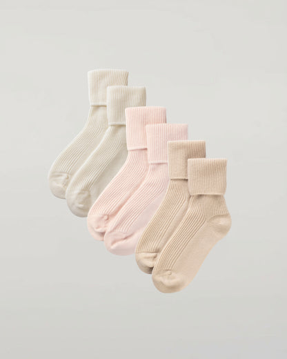 Johnstons of Elgin set of three pairs of cashmere socks in pastel colours on a light grey background 2025GIFTSET3A